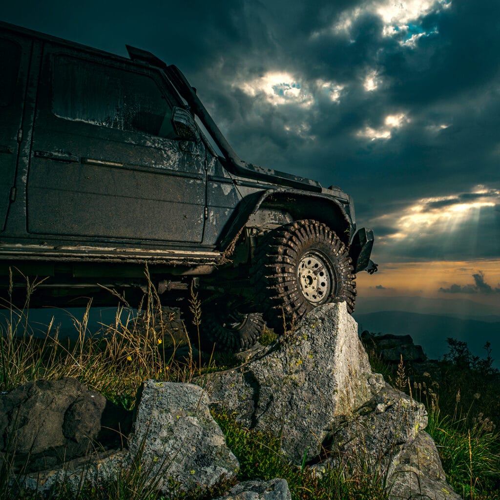 Off road vehicle parked on a cliff