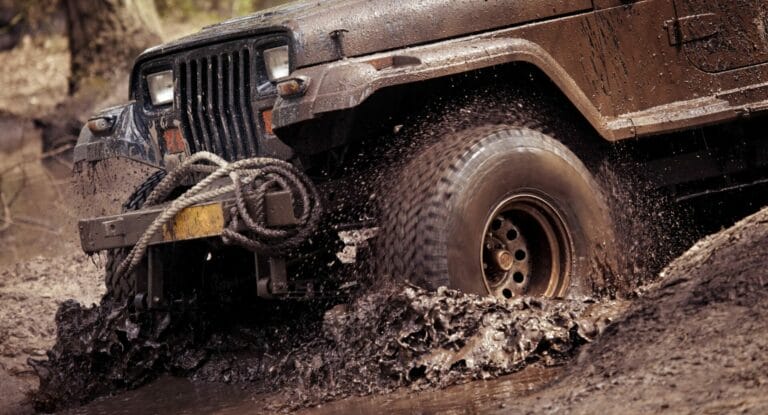 Jeep going through mud